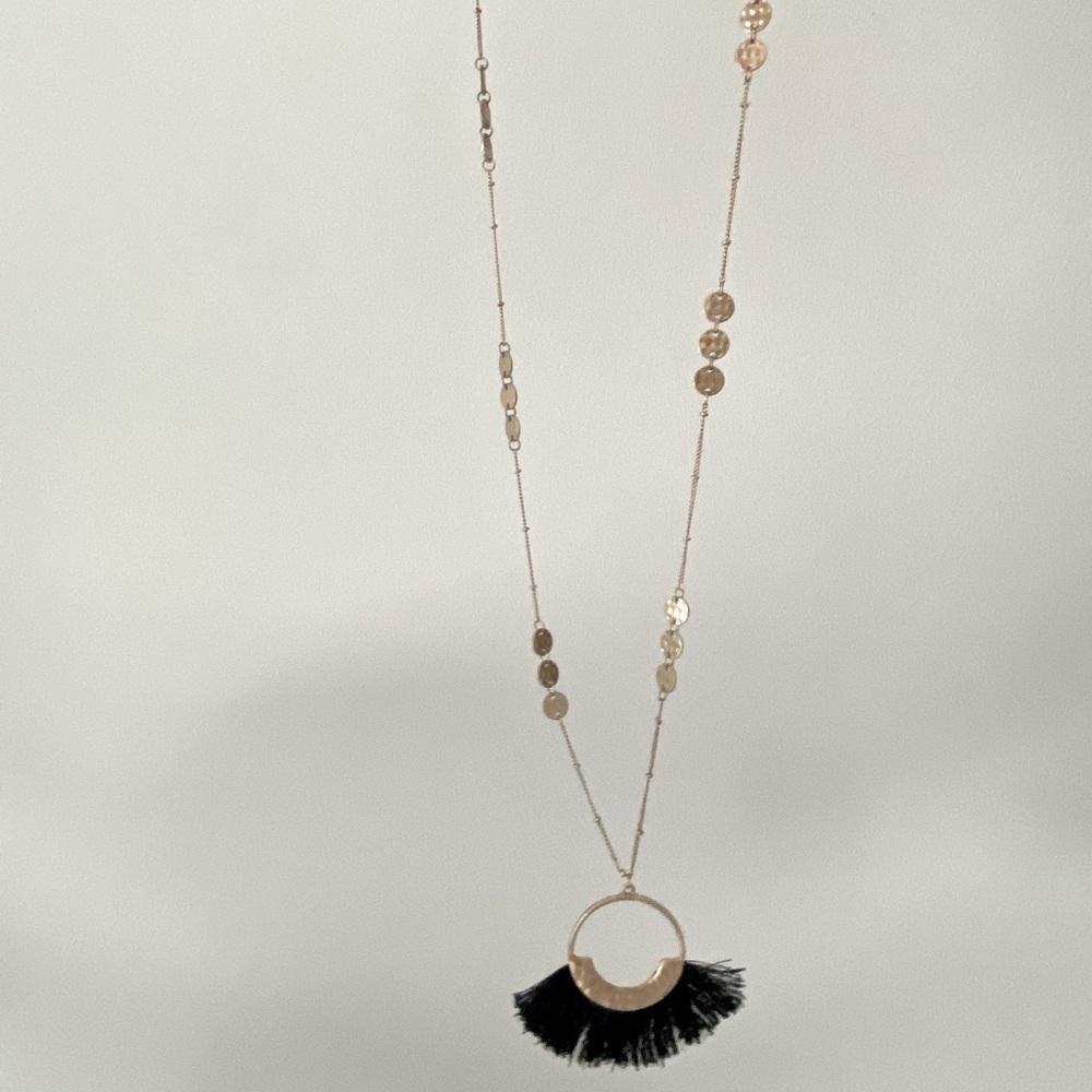 Francesca’s gold and black tassel necklace